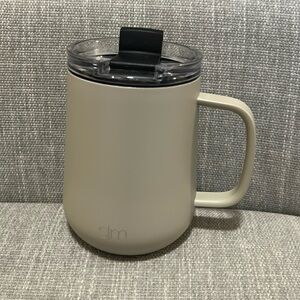 SM insulated coffee cup with twist on and sealable lid light brown in color